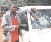 Windscreen smashed by orange throwing thugs
