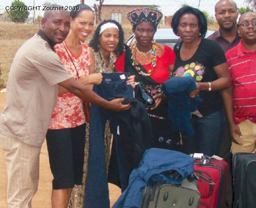 Visitors from US donate clothes to poor families