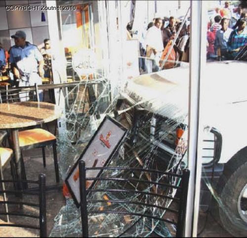Patrons panic after runaway car crashes into a restaurant.