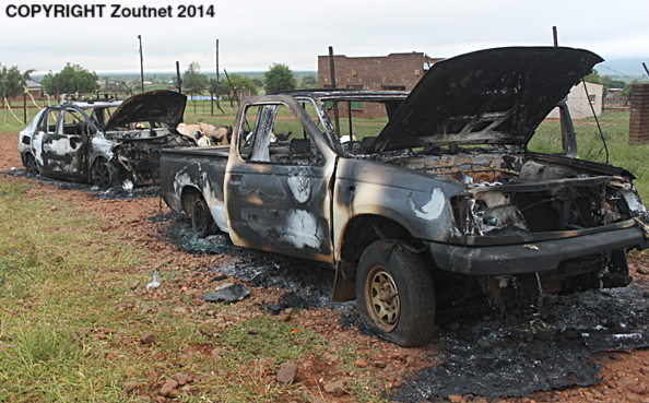 Angry community destroy houses and cars