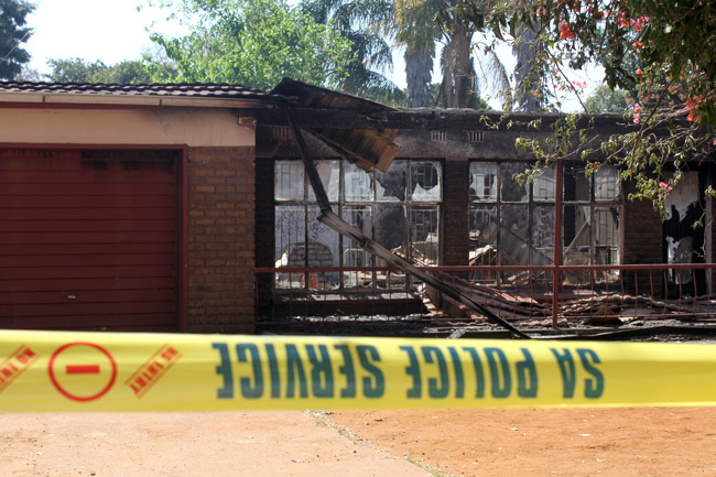 Arson investigated after police house burns down