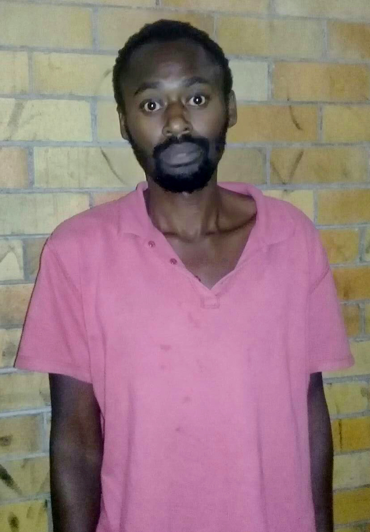 Alleged cop killer remains in custody