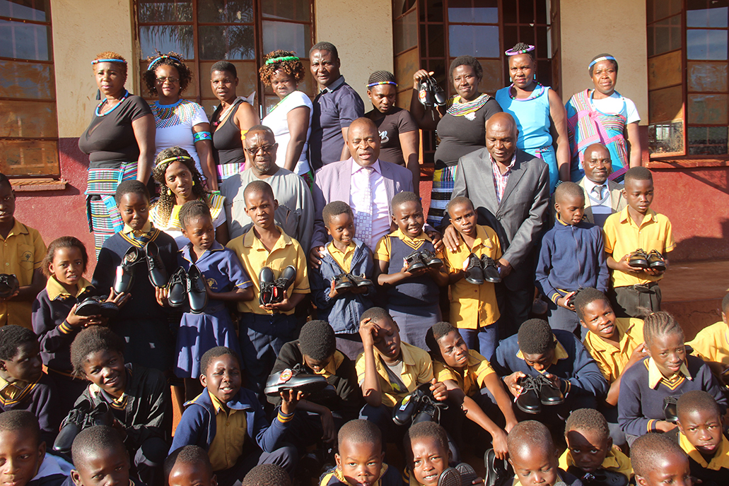 Caring chief ploughs back to community