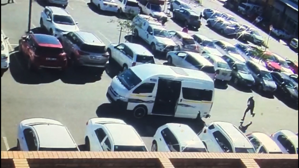 Woman robbed in busy parking lot