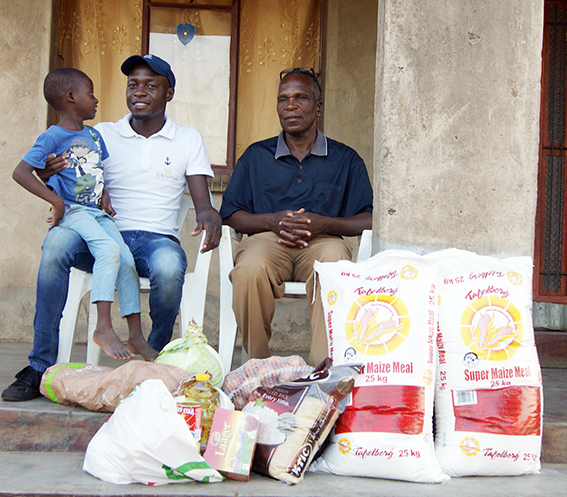 Orphans get food parcels, while waiting for certificate to be issued