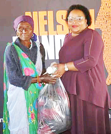 Deputy Minister interacts with elderly people