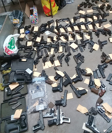 Shock after police confiscate 152 guns