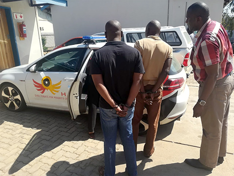 Police officers in court following arrest