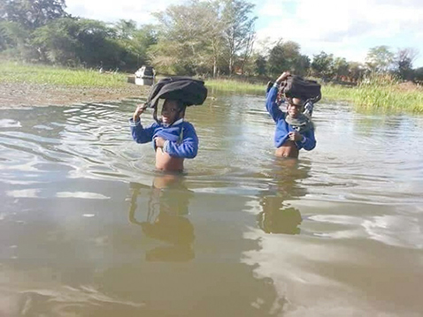 Heavy rains wash away bridges and houses