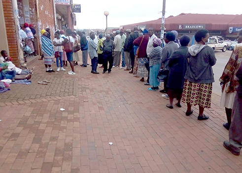 Watch: Towns busy while SASSA recipients line up