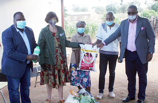 Creecy distributes food parcels and water tanks