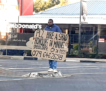 Mining graduate takes to street corner to try and find a job