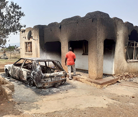 Family left with nothing after mob torches house in search of suspect