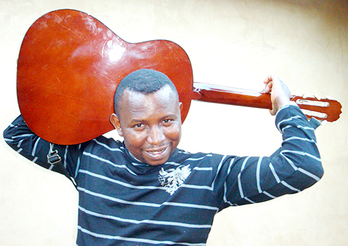 Netshikweta has a unique way of playing guitar
