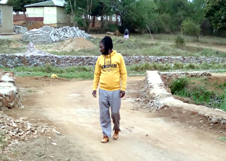 Resident abandons building his house to build community bridge