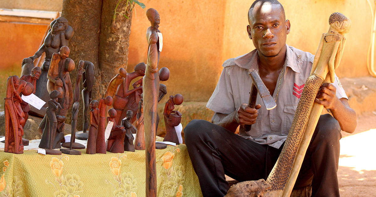 Kenneth reflects society through his wood sculptures