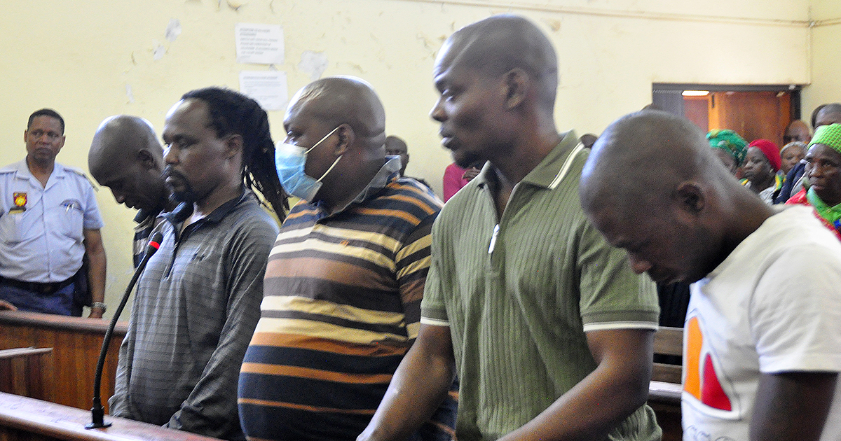 All five suspects in dock together for mayor's murder