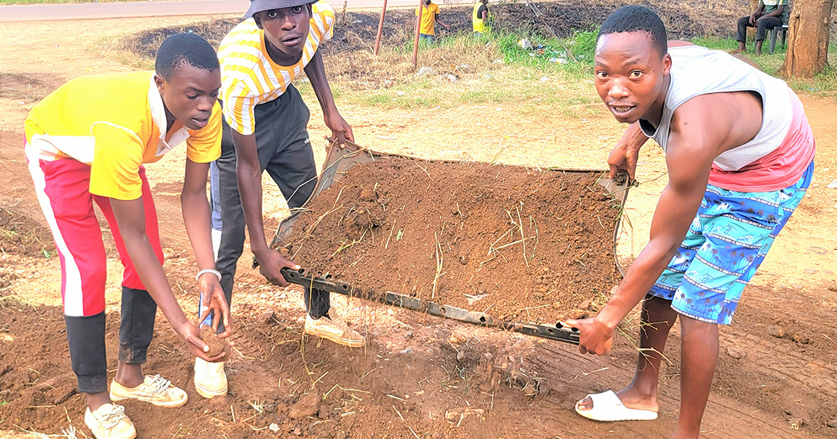Young volunteers fix village's pothole infested roads