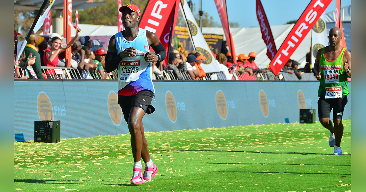 Madzhie wins his Bill Rowan Comrades medal in his sandals